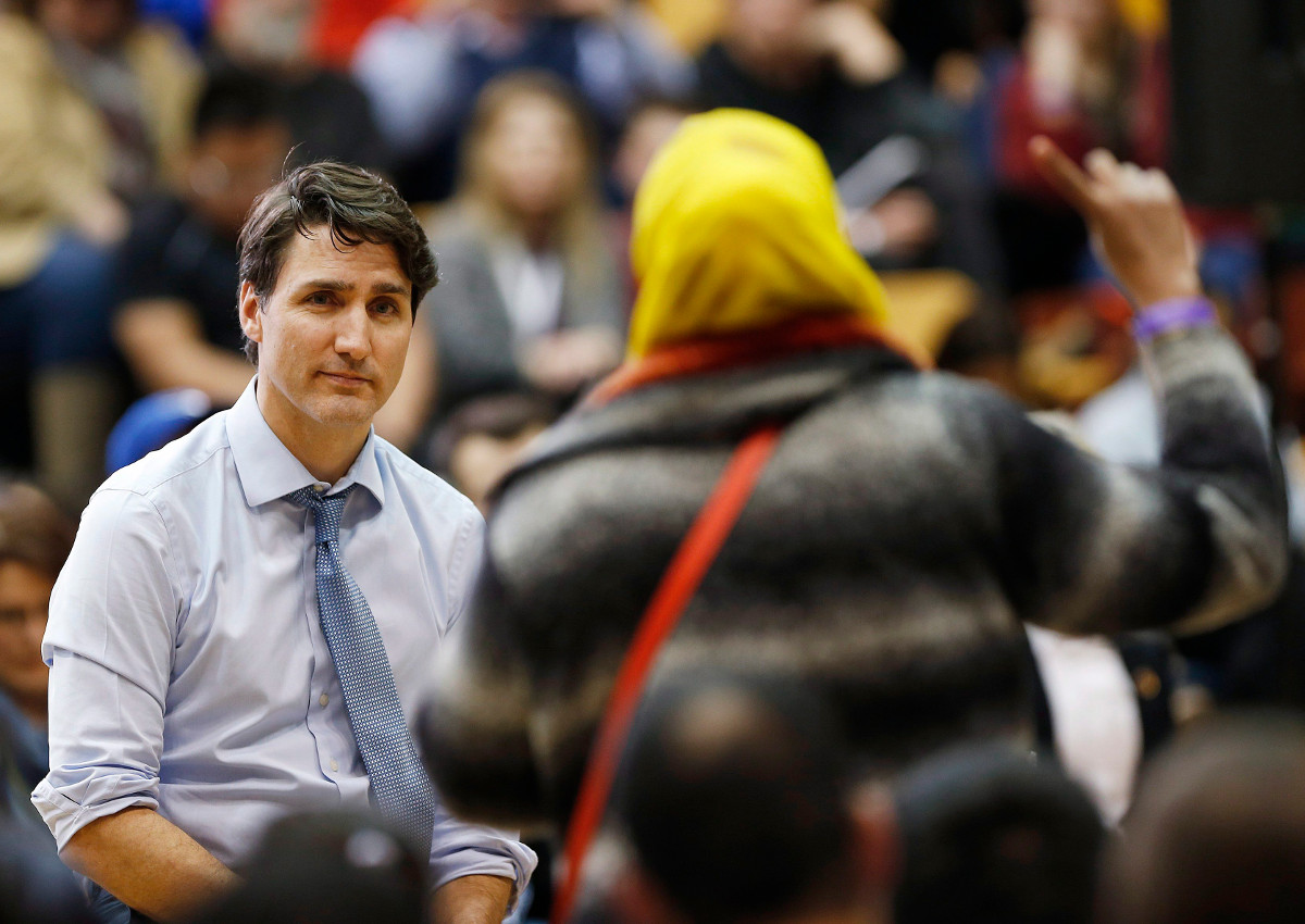 Prime Minister Justin Trudeau listens to a question about Child and Family Services at a town hall meeting at the University of Manitoba in Winnipeg, Wednesday, January 31, 2018.