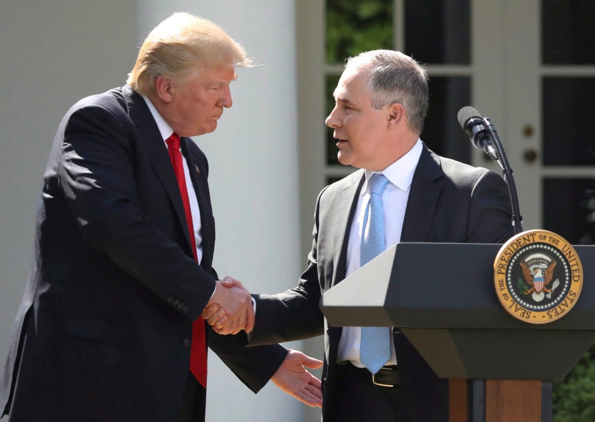 In this June 1, 2017 file photo, President Donald Trump shakes hands with EPA Administrator Scott Pruitt after speaking about the U.S. role in the Paris climate change accord in the Rose Garden of the White House in Washington.