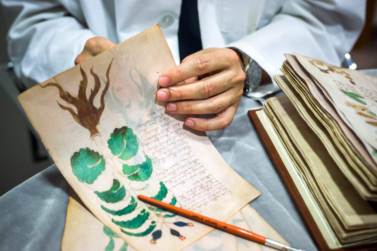 Quality control operator of the Spanish publishing outfit Siloe Luis Miguel works on cloning the illustrated codex hand-written manuscript Voynich in Burgos on August 9, 2016.