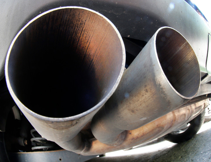 In this Aug. 2, 2017 file photo, the exhaust pipes of a VW diesel car are photographed in Frankfurt, Germany. 