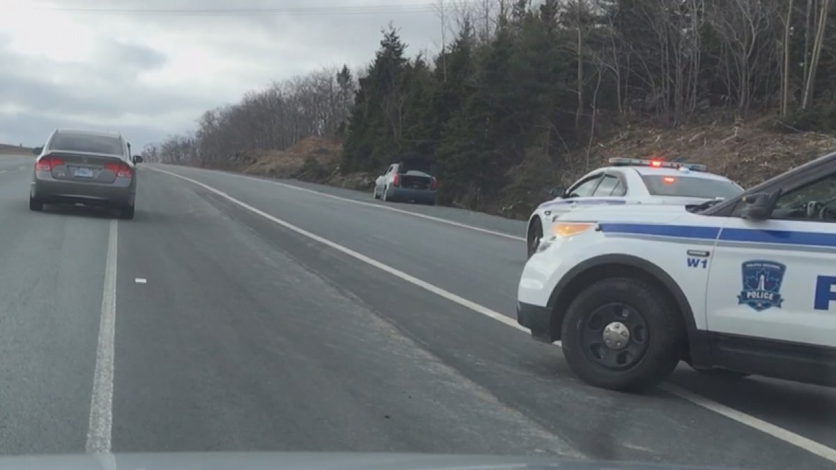Police are examining a suspicious package found inside a small black car along the side of Highway 102.