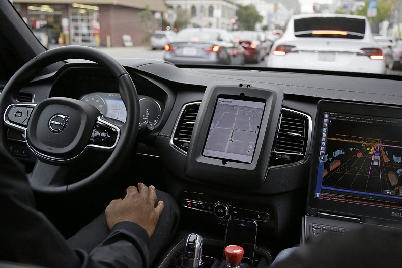 An Uber driverless car waits in traffic during a test drive in San Francisco in late 2016.