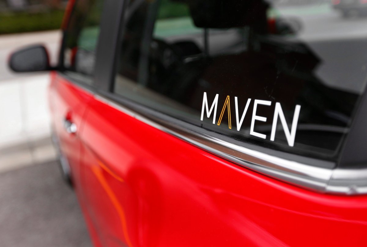 FILE - This April 27, 2016, file photo, shows the Maven logo on a General Motors car-sharing service automobile, in Ann Arbor, Mich. General Motors Co. launched its Maven car-sharing service in New York on Monday, May 15, 2017. The service lets members rent a variety of GM vehicles for whatever they need, from a 30-minute errand to a 28-day road trip.
