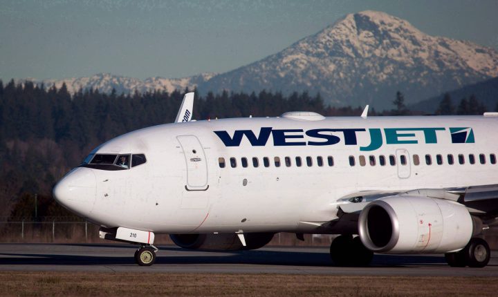 A pilot taxis a Westjet Boeing 737-700 plane to a gate after arriving at Vancouver International Airport. 