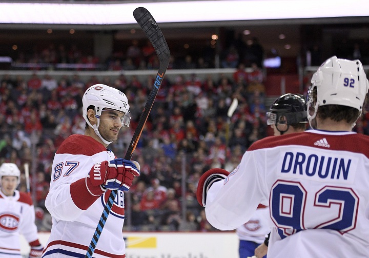 In this file photo, Montreal Canadiens left wing Max Pacioretty (67) celebrates his goal with center Jonathan Drouin (92) during the second period of an NHL hockey game.  Drouin suffered an upper body injury in a game against Anaheim in Montreal. Saturday, Feb. 3, 2018.