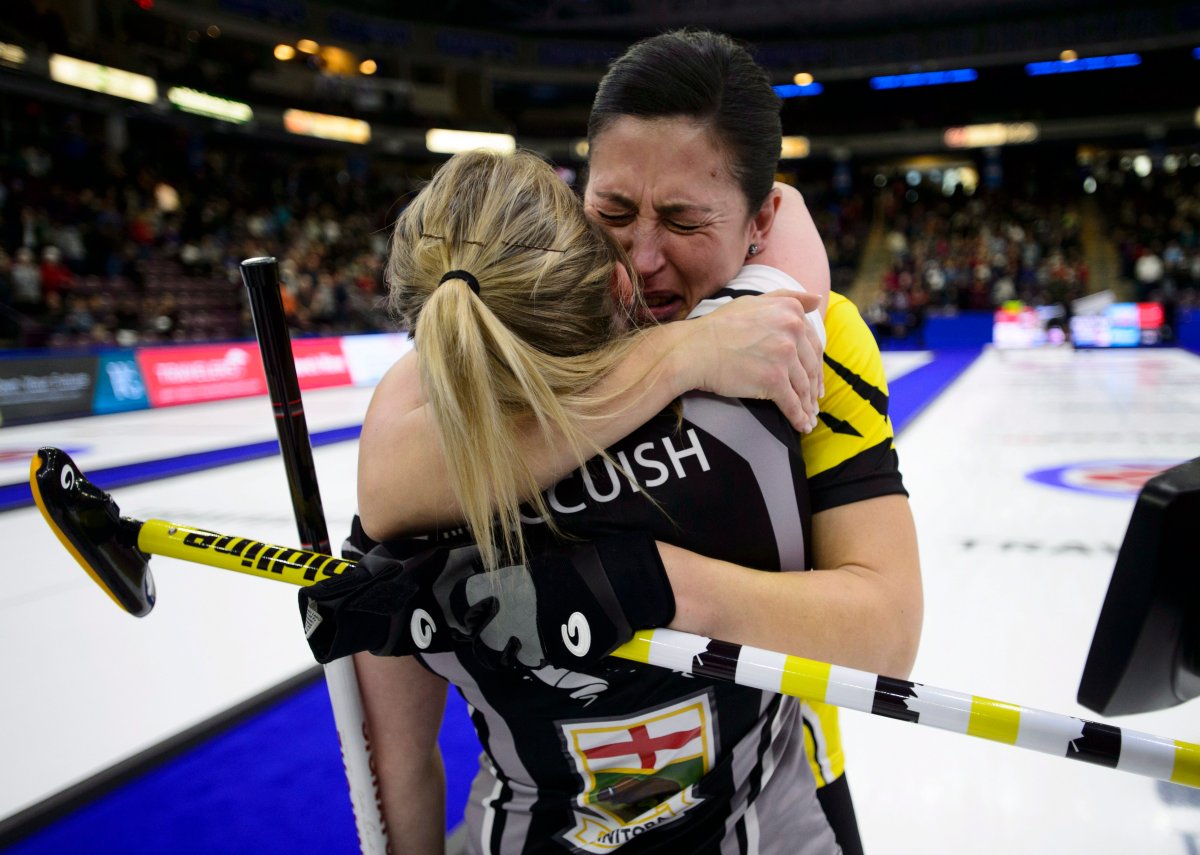Manitoba second Jill Officer, left, hugs her niece Wild Card lead Kristin MacCuish after defeating her to take the win at the Scotties Tournament of Hearts in Penticton, B.C., on Sunday, Feb. 4, 2018. THE CANADIAN PRESS/Sean Kilpatrick.