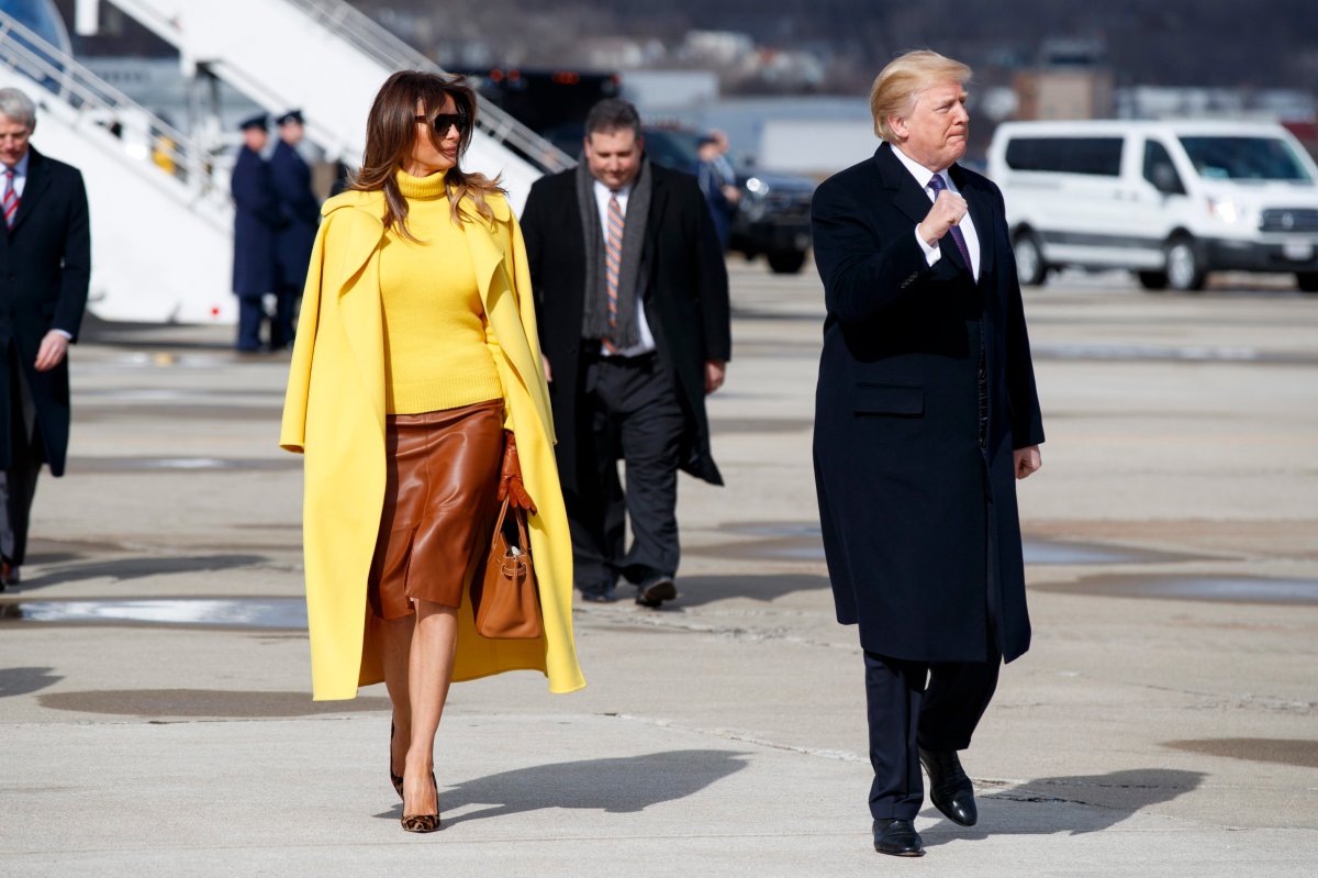 President Donald Trump and first lady Melania Trump walk to greet supporters after arriving at Cincinnati Municipal Lunken Airport, Monday, Feb. 5, 2018, in Cincinnati.