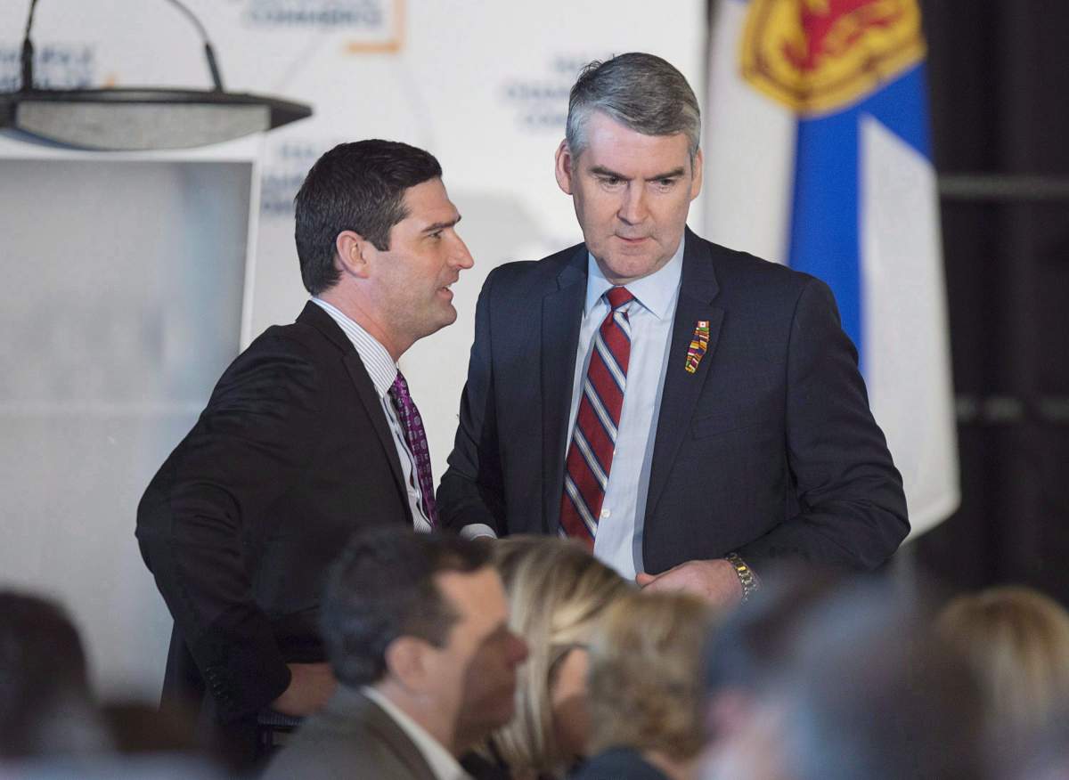 Premier Stephen McNeil, right, chats with Geoff MacLellan, government house leader, before he delivers the state-of-the-province speech at a business luncheon in Halifax on Wednesday, Feb. 7, 2018. 