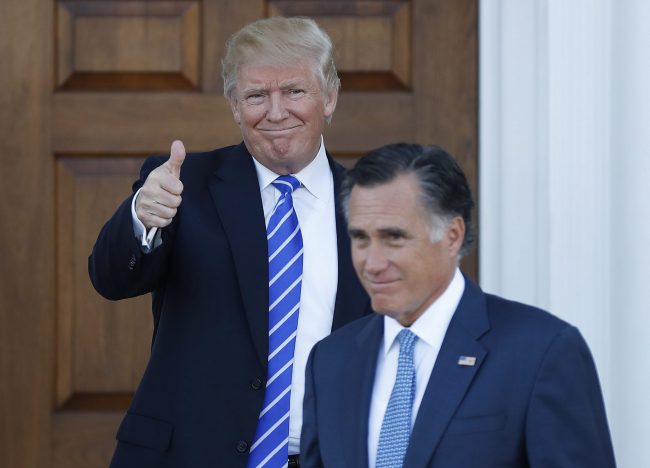 This Nov. 19, 2016, file photo shows President-elect Donald Trump giving the thumbs-up as Mitt Romney leaves Trump National Golf Club Bedminster in Bedminster, N.J. 