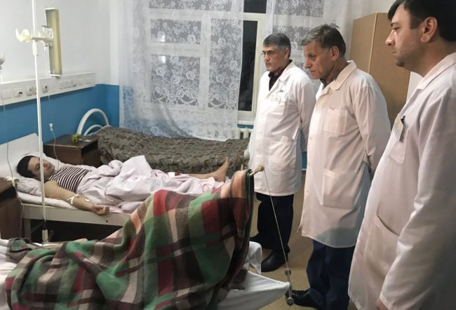 Doctors examine a wounded man in the hospital after shooting near the church in Kizlyar Dagestan, Russia, 18 February 2018.