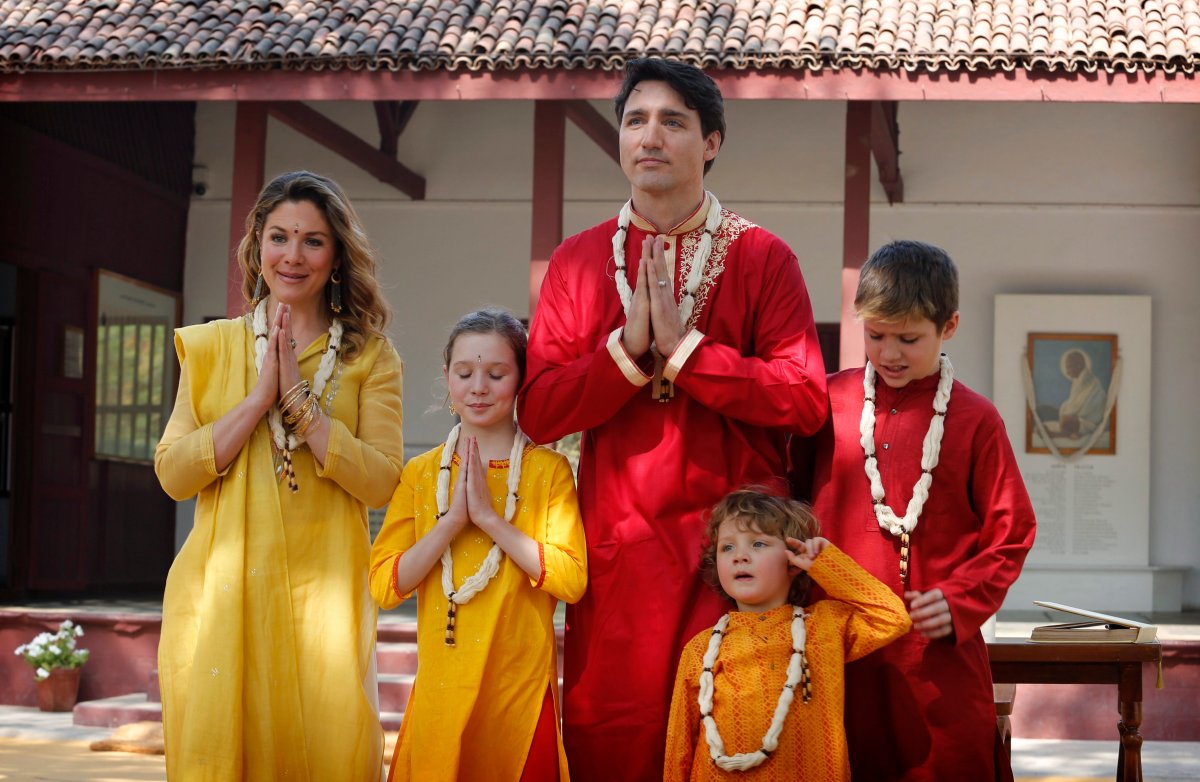 Canadian Prime Minister Justin Trudeau, center, his wife, Sophie Gregoire Trudeau, their sons Hadrien, second from right, and Xavier, daughter Ella-Grace, second from left, greet media in an Indian style of "Namasteas" during their visit of Sabarmati Ashram or Mahatma Gandhi Ashram in Ahmadabad, India, Monday, Feb. 19, 2018.