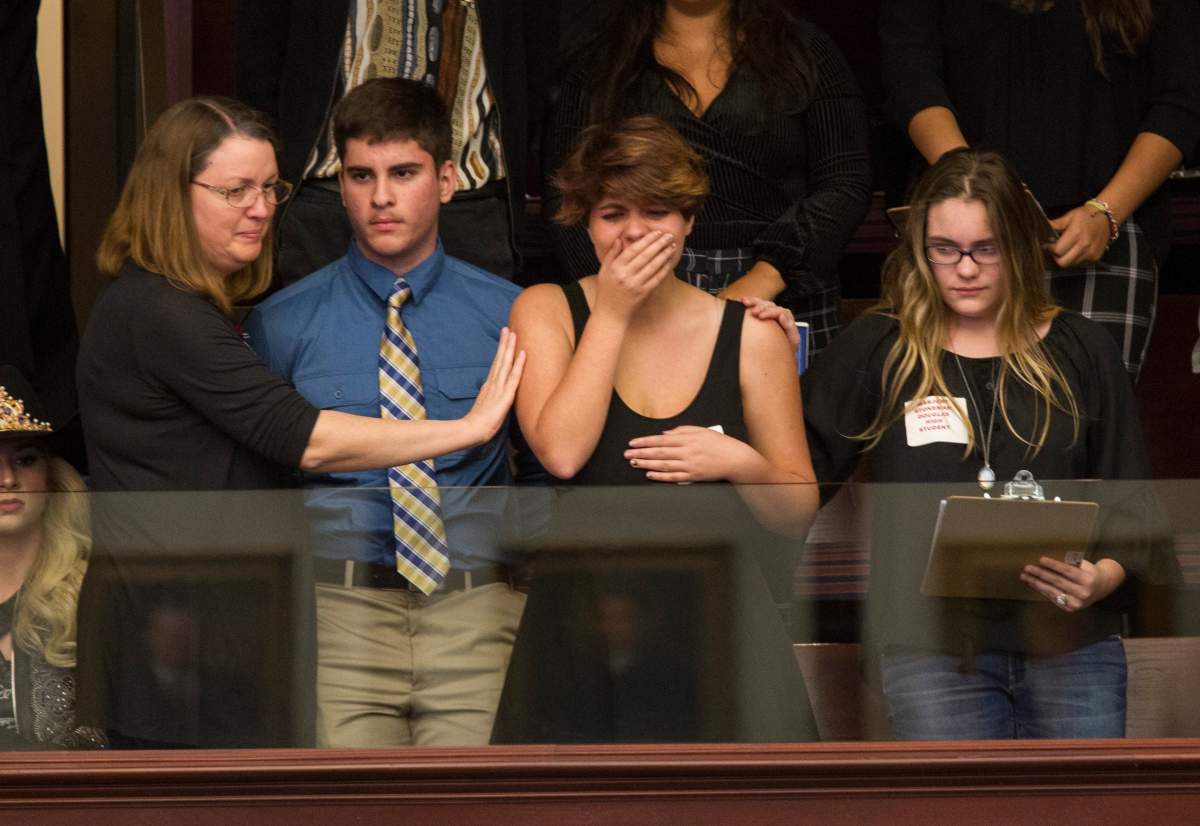 Sheryl Acquarola, a 16 year-old junior from Marjory Stoneman Douglas High School is overcome with emotion in the east gallery of the House of Representatives after the representatives voted not to hear the bill banning assault rifles and large capacity magazines at the Florida Capital in Tallahassee, Fla., Feb 20, 2018.