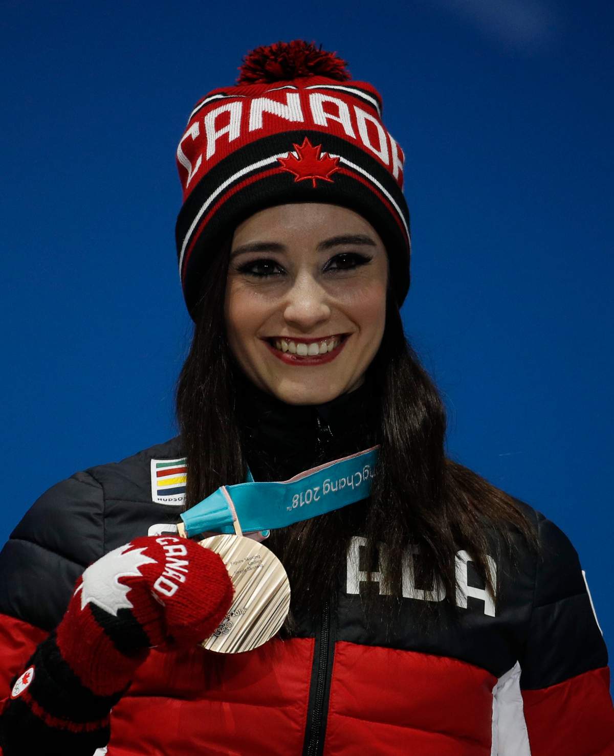 Bronze medalist in the women’s free figure skating Kaetlyn Osmond, of Canada poses during the medals ceremony at the 2018 Winter Olympics in Pyeongchang, South Korea, Friday, Feb. 23, 2018.
