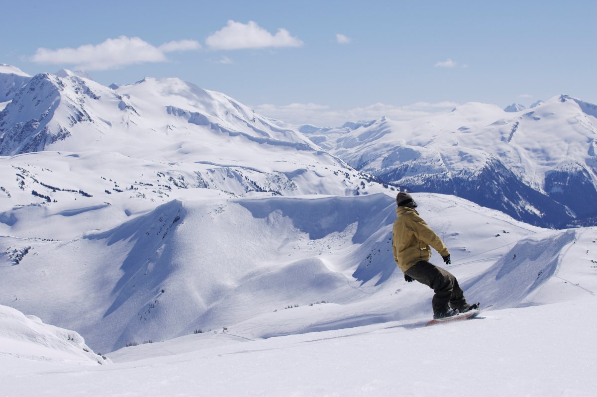 A rider takes on the terrain while snowboarding at Whistler Blackcomb.