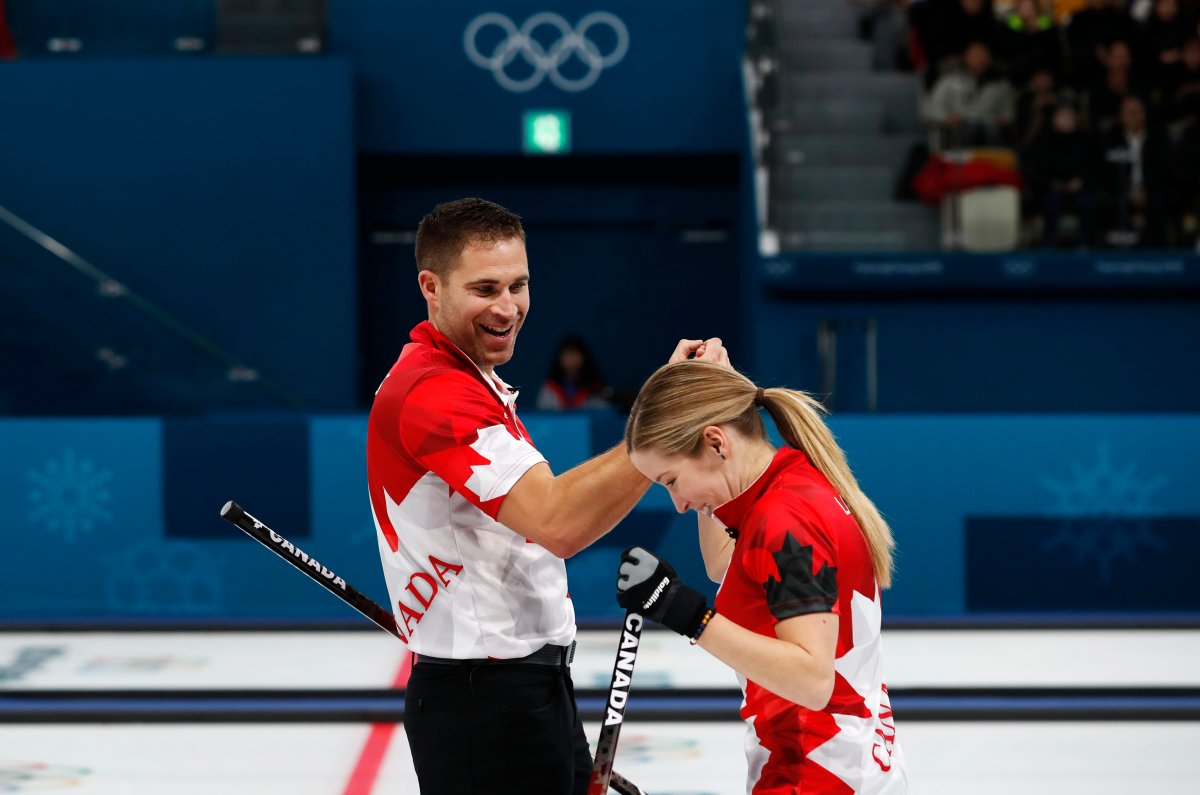Curling – Pyeongchang 2018 Winter Olympics – Mixed Doubles Semi-final - Canada v Norway - Gangneung Curling Center - Gangneung, South Korea – February 12, 2018 - Kaitlyn Lawes and John Morris of Canada celebrate. 