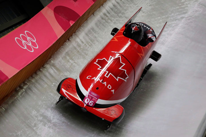 Driver Justin Kripps and Alexander Kopacz of Canada take a curve during the two-man bobsled competition at the 2018 Winter Olympics in Pyeongchang, South Korea, Sunday, Feb. 18, 2018.