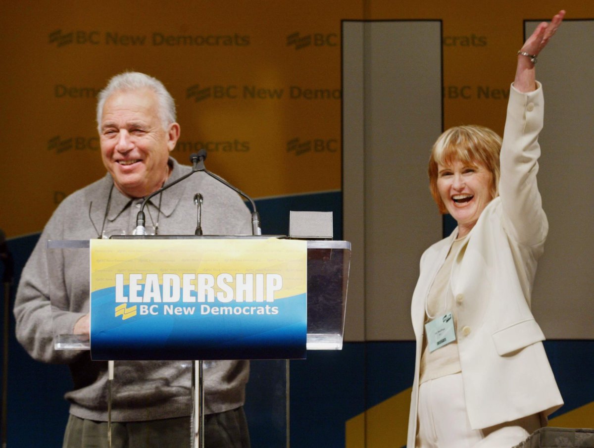 Joy MacPhail (right) waves to the delegates at the B.C. provincial NDP Convention in Vancouver prior to leaving the stage with former B.C. premier Dave Barrett after presenting honorary life memberships, Friday, Nov. 21, 2003.
