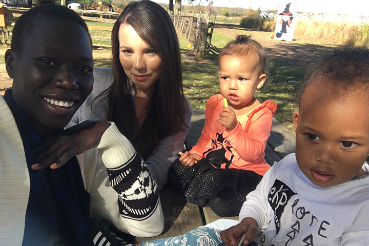 Lilian Yange (left) and Angel Foley (right) with their children. 