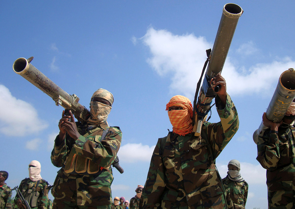 FILE PHOTO: Members of Somalia's al-Qaeda linked al Shabaab militia hold their weapons in Mogadishu, Somalia January 1, 2010. 