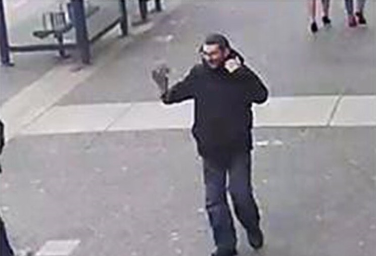 Police say the suspect fled north on Douglas Street and was seen changing his appearance as he went.