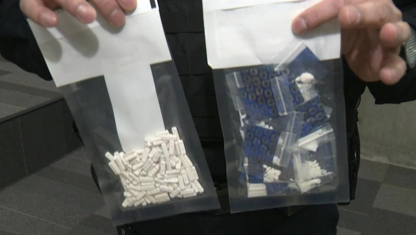 Sgt. Jag Khosa of the CFSEU-BC holds up baggies in an interview with Global News.