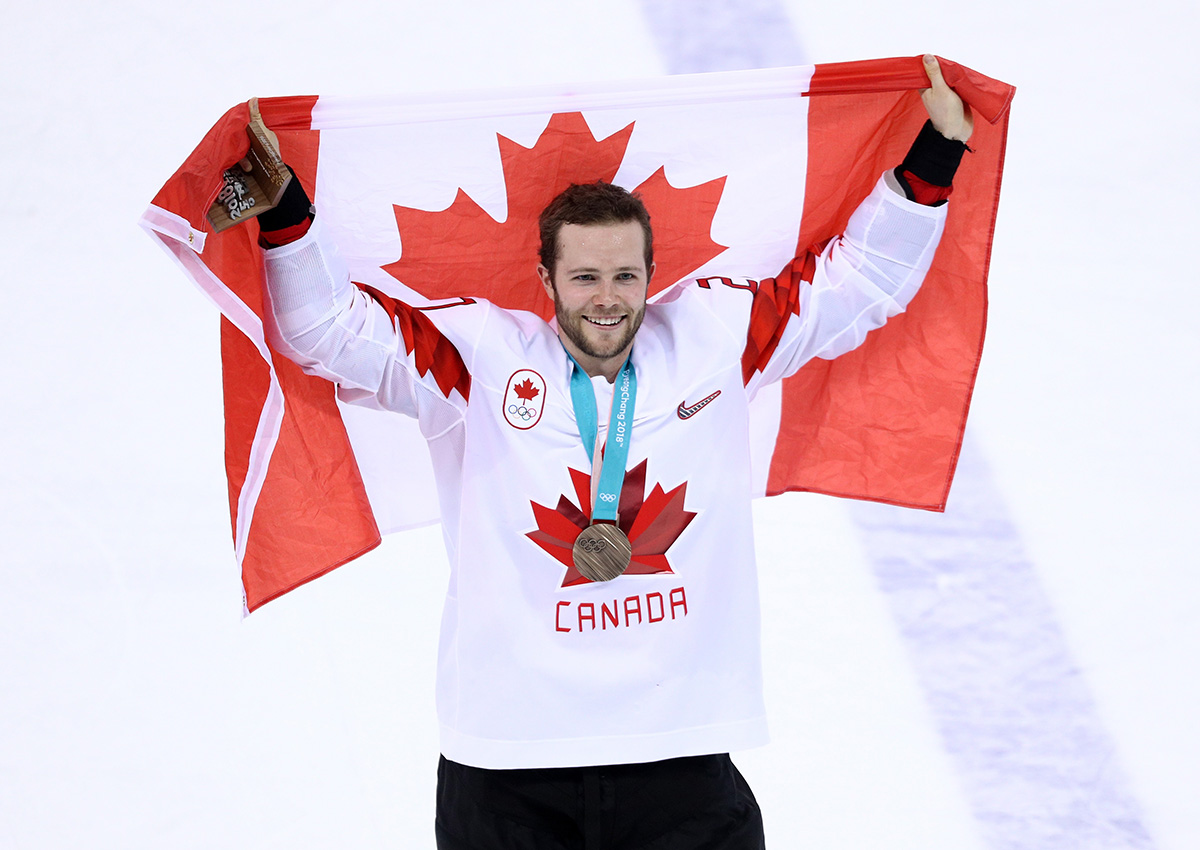 Bronze medal winner Cody Goloubef of Canada celebrates after defeating Czech Republic 6-4 .