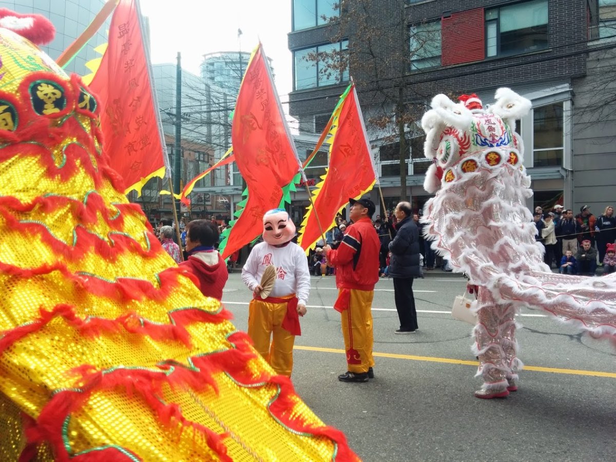Participants march down Pender Street as a part of Vancouver's Chinese New Year Parade.