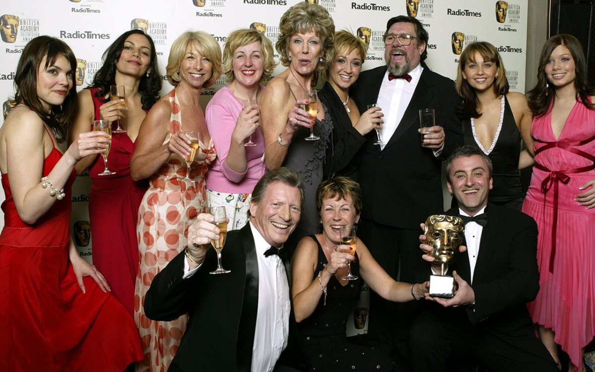 The cast of 'Coronation Street' pose in the pressroom with awards for Best Continuing Drama following the "British Academy Television Awards" at the Grosvenor House Hotel on April 18, 2004, in London.