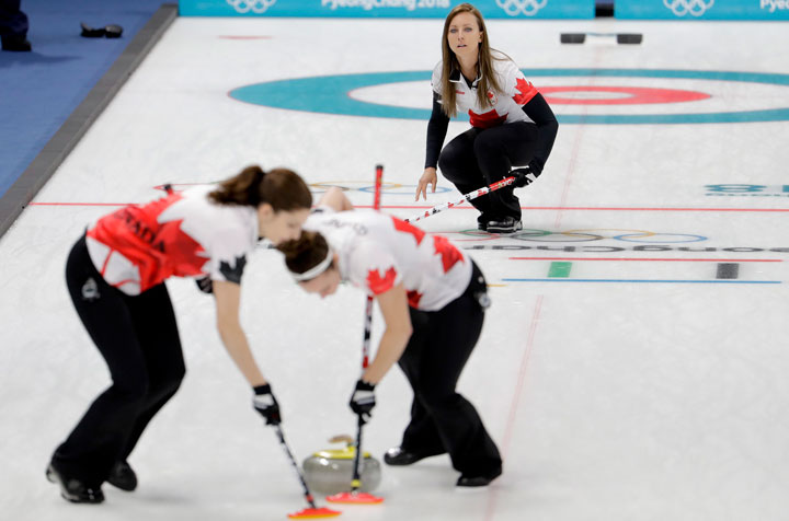 Canada's skip Rachel Homan, above, watches teammates sweep the ice during a women's curling match against Denmark at the 2018 Winter Olympics in Gangneung, South Korea, Friday, Feb. 16, 2018.