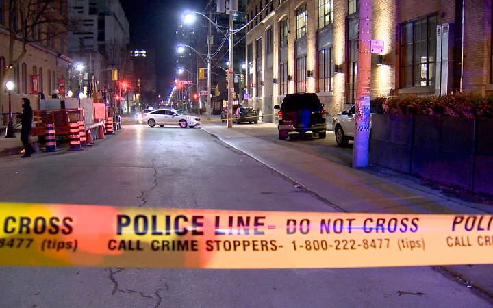 Police block off the scene of a shooting in Toronto's entertainment district on Feb. 26, 2018.