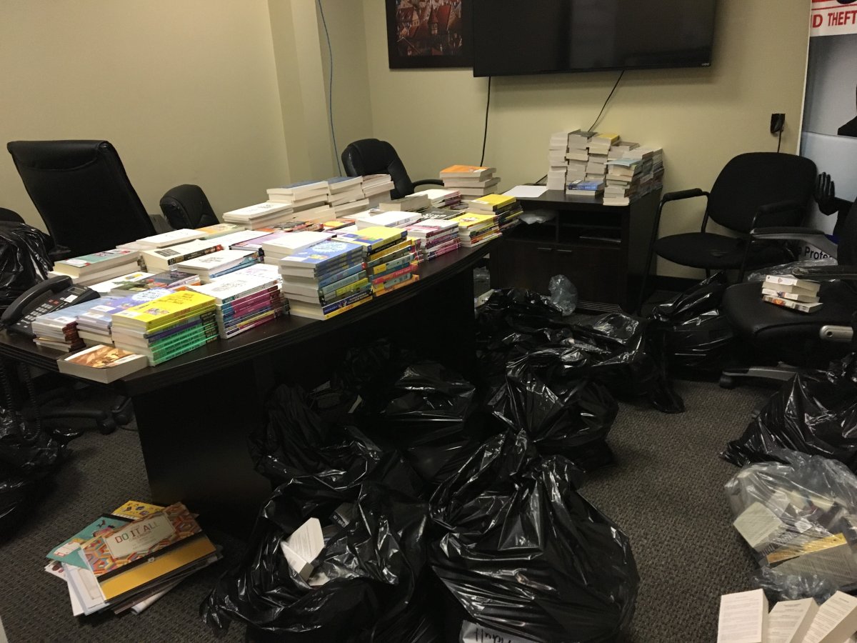Calgary family disheartened to find thousands of new books tossed in