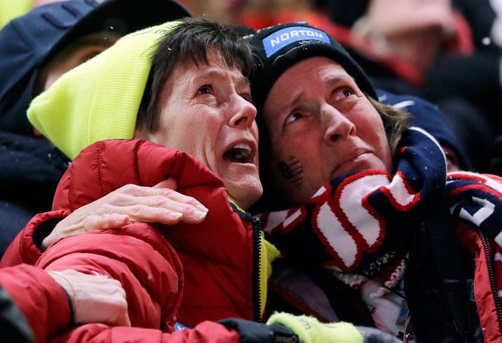 Sue Sweeney, left, the mother of Emily Sweeney of the United States, cries out as her daughter crashes at Curve 9 on the final run during the women’s luge final at the 2018 Winter Olympics in Pyeongchang, South Korea, Tuesday, Feb. 13, 2018.