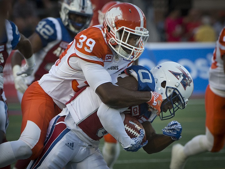 Chandler Fenner crushes Stefan Logan during a CFL game between the BC Lions and Montreal Alouettes on July 06, 2017.  