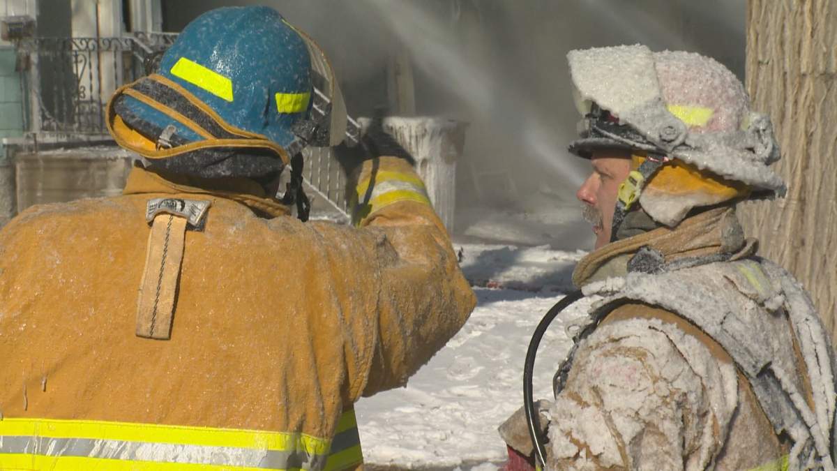 Frost built up quickly on fire fighters as they battled the Rae Street fire in -30 degree weather.