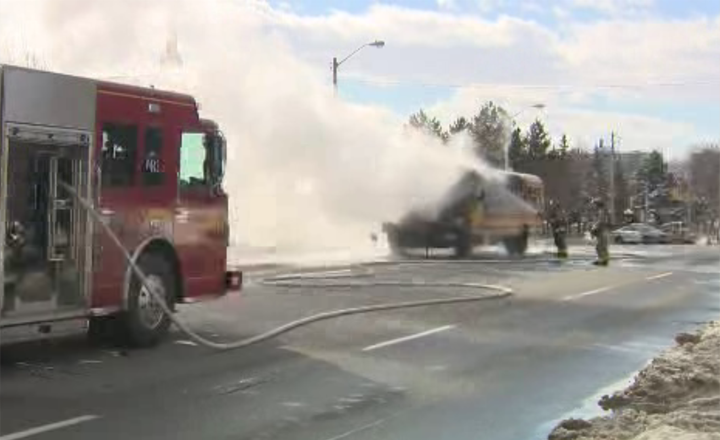 Toronto firefighters respond after a school bus caught on fire in Etobicoke on Monday, Feb. 12.