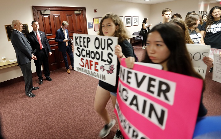 n this file photo, student survivors from Marjory Stoneman Douglas High School, where more than a dozen students and faculty were killed in a mass shooting on Wednesday, walk past the house legislative committee room, to talk to legislators at the state Capitol, regarding gun control legislation, in Tallahassee, Fla., Wednesday, Feb. 21, 2018.