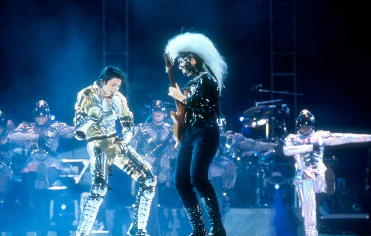 American singer songwriter Michael Jackson and guitarist Jennifer Batten perform live on stage at the Sydney Cricket Ground during his ‘HIStory’ world concert tour on Nov. 14, 1996 in Sydney, Australia.