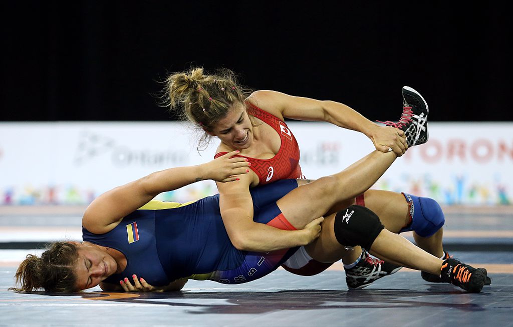 Michelle Fazzari of Canada (red) and Sandra Roa of Colombia (blue) compete in the Women's 58kg Freestyle Quarterfinals during the Toronto 2015 Pan Am Games at the Mississauga Sports Centre on July 16, 2015.