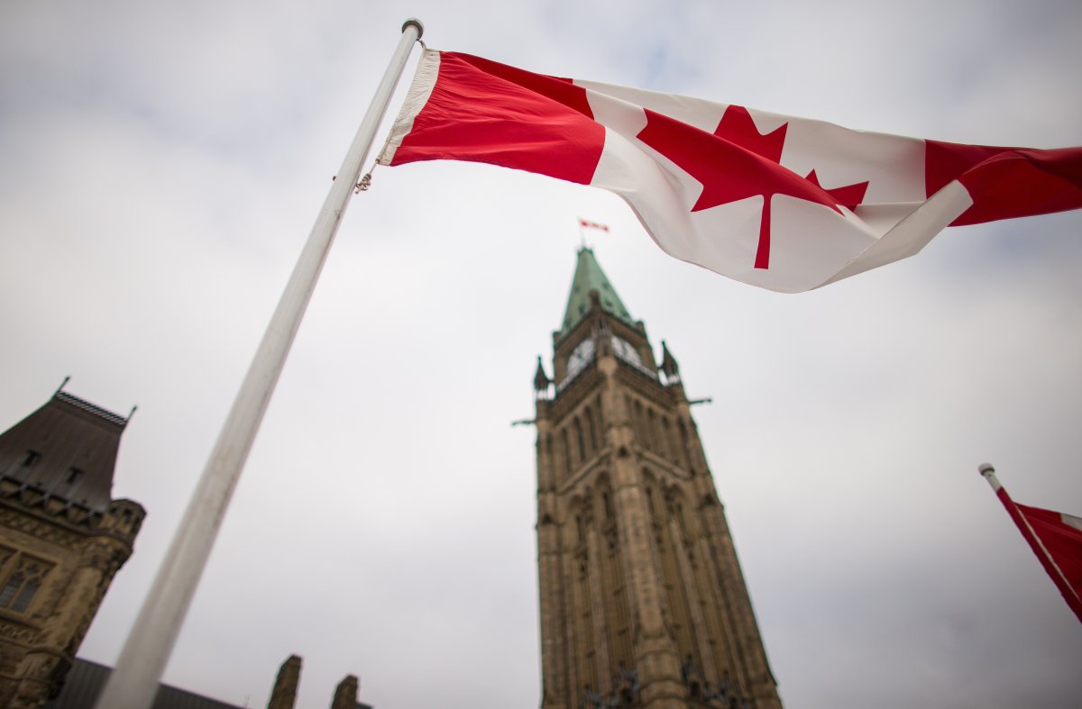 The Canadian flag flies over parliament.