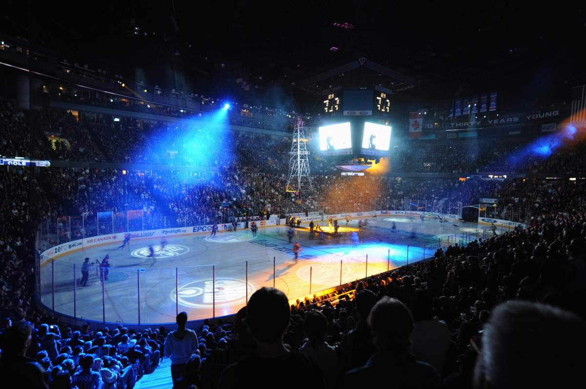 Fans watch an Oil Derrick drop and the opening light show before the game between the Edmonton Oilers and Colorado Avalanche on Oct. 12, 2008 at Rexall Place in Edmonton, Alberta, Canada.