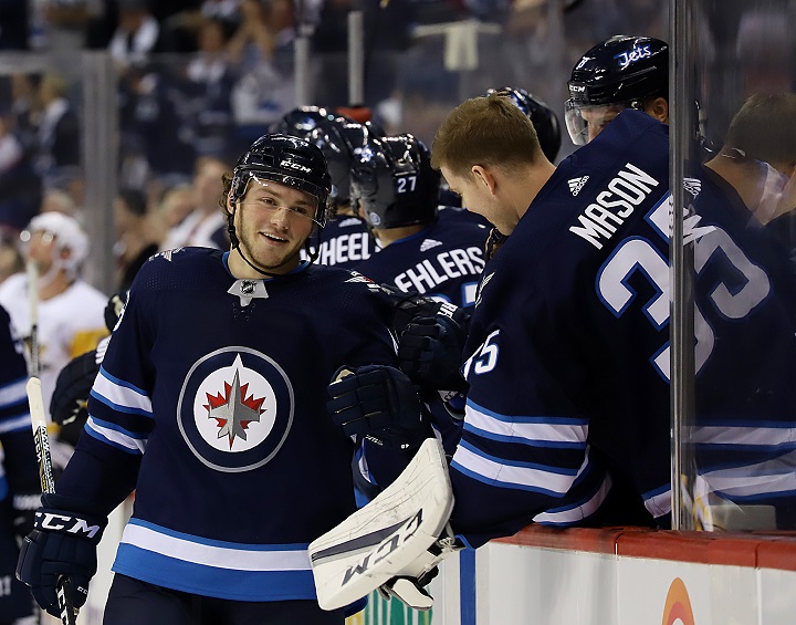 Brendan Lemieux of the Winnipeg Jets is all smiles as he celebrates his first career NHL goal against the Pittsburgh Penguins at Bell MTS Place on Oct. 29, 2017.