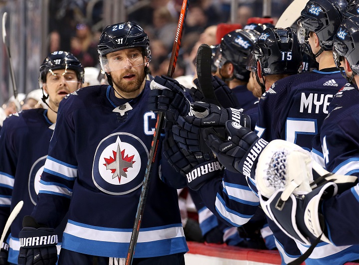 Blake Wheeler of the Winnipeg Jets celebrates his first period goal against the Colorado Avalanche with teammates at Bell MTS Place on Feb. 16, 2018 in Winnipeg.