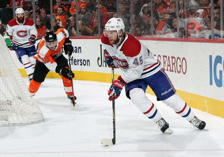 Joe Morrow skates the puck against Jordan Weal in a game between the Montreal Canadiens and Philadelphia Flyers on Feb. 20, 2018 at the Wells Fargo Center in Philadelphia.