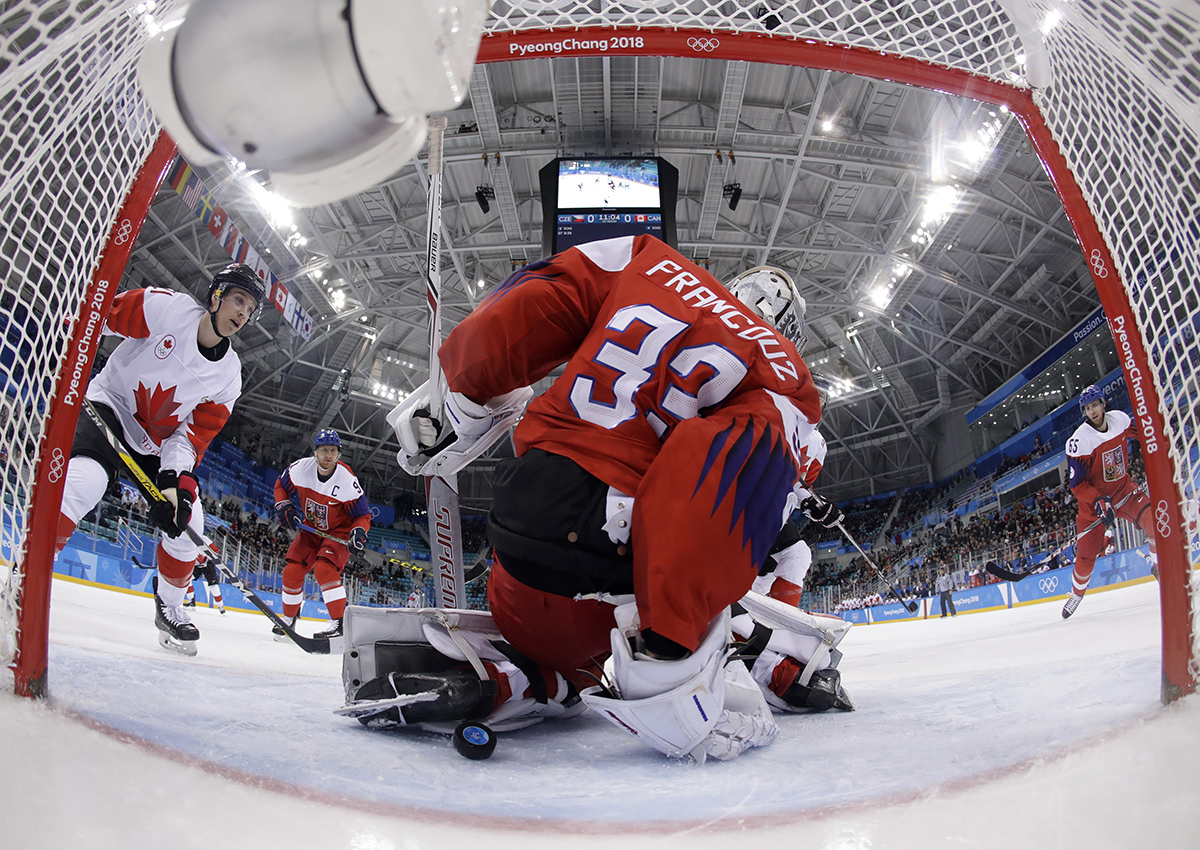 A shot from Andrew Ebbett gets by Czech Republic goalie Pavel Francouz.