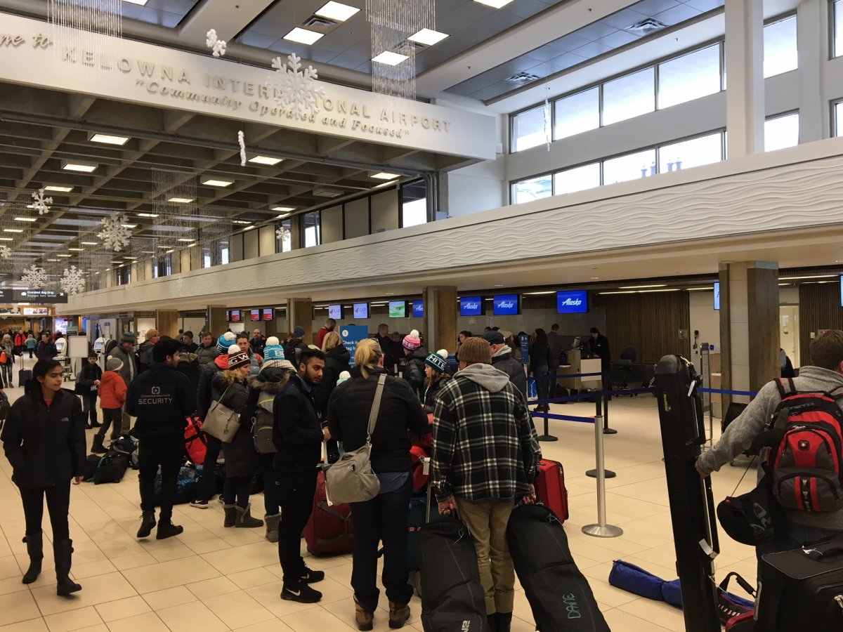 Passengers inside the Kelowna airport terminal waiting to leave Friday.