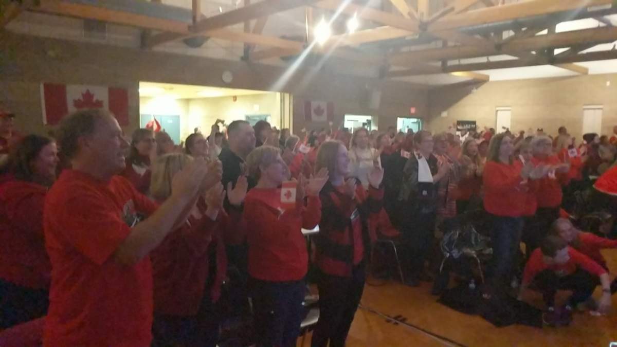 The crowd of nearly 300 people rise to their feet following a flawless skate from Scott Moir and Tessa Virtue.
