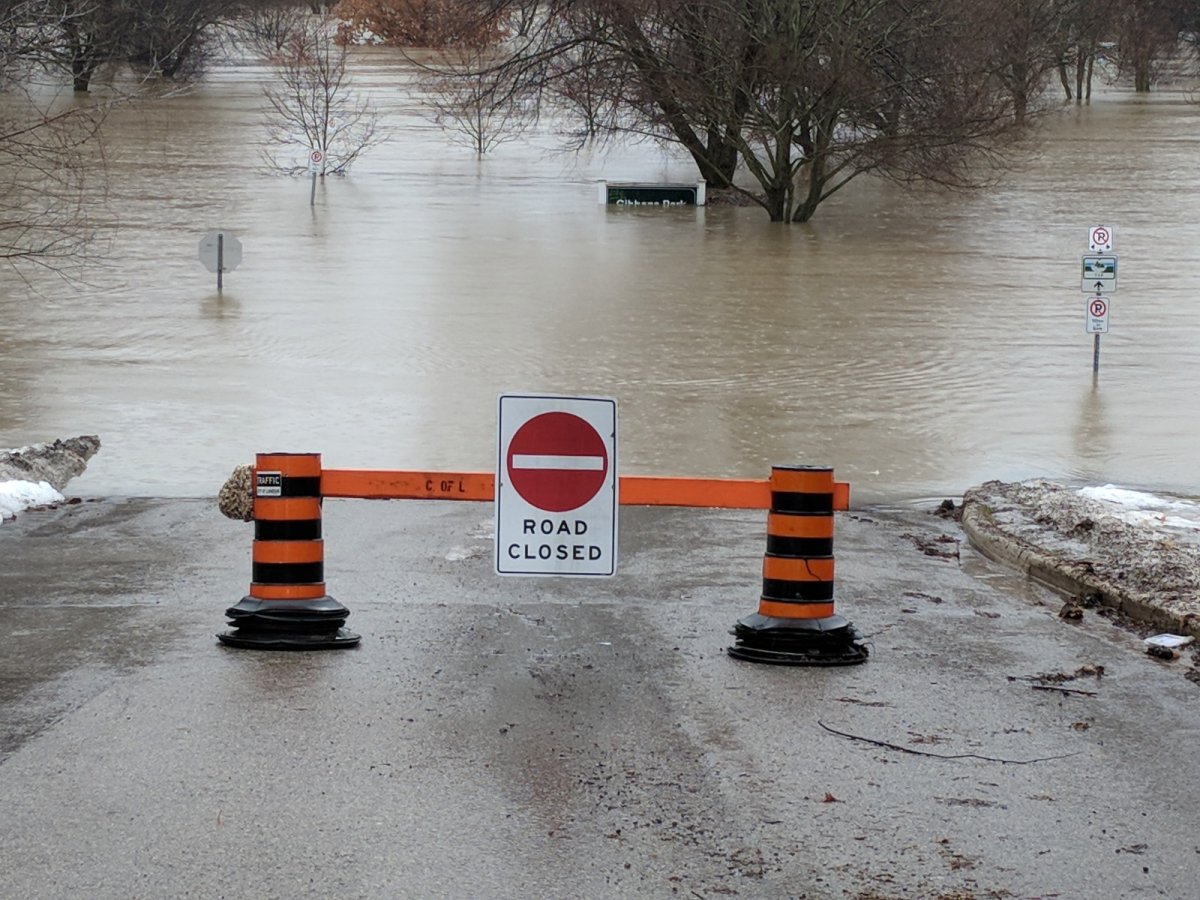 Gibbons Park is one of several city parks along the Thames River to be closed Wednesday morning. The sign at Gibbons Park is barely visible, nearly fully engulfed by the rising water of the Thames River. (Jake Jeffrey / 980 CFPL).