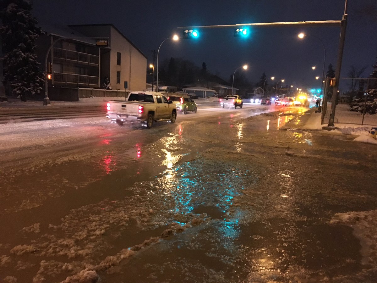 EPCOR crews responded to to 111 Avenue between 129 Street and 130 Street Wednesday morning, where water was flooding the road by the adjacent Westmount Junior High School. Edmonton, Alta. January 7, 2018.