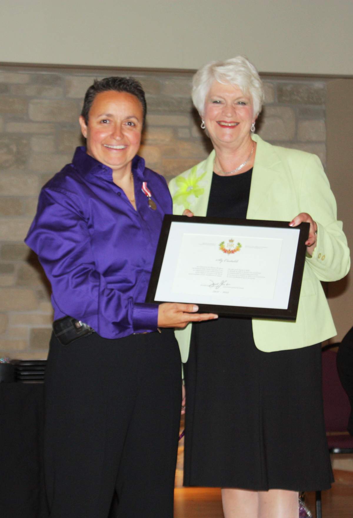 Guelph-Wellington Women in Crisis Executive Director Sly Castaldi and MPP Liz Sandals .