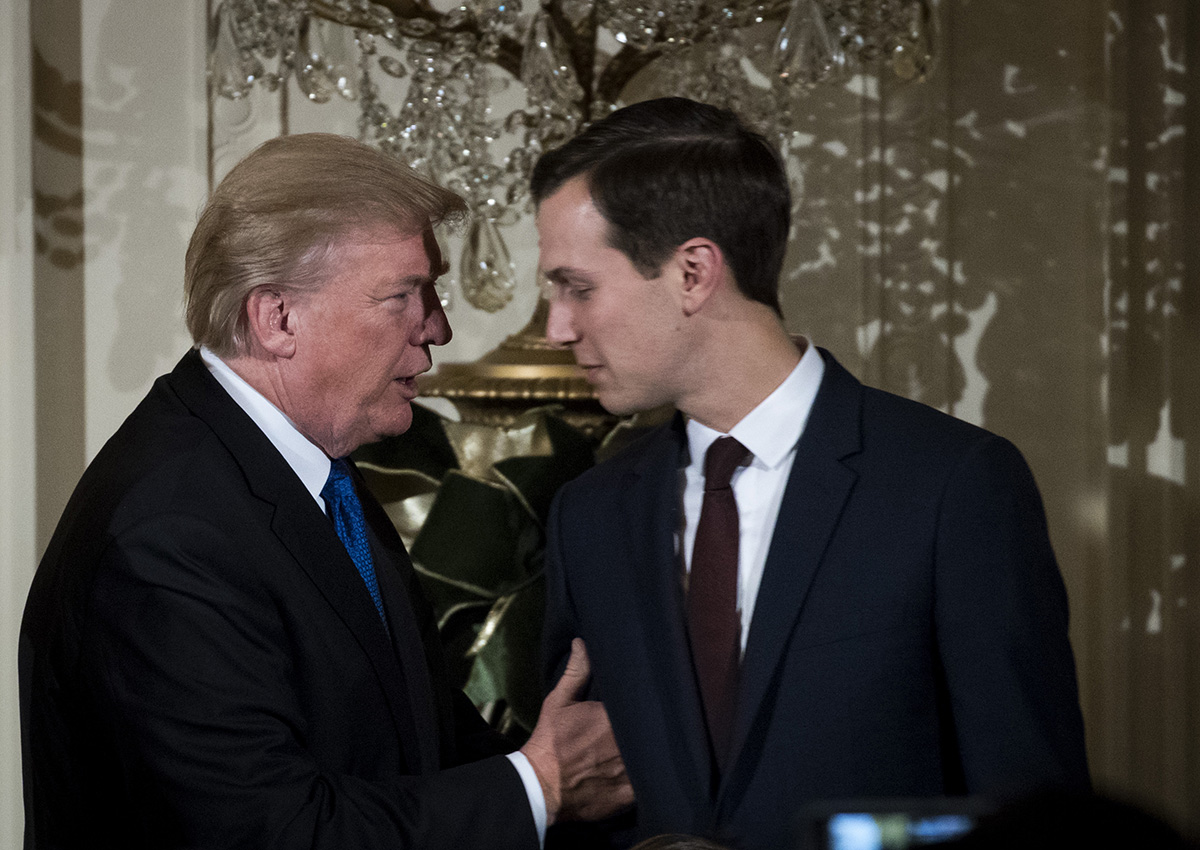 Donald Trump talks with White House Senior Advisor to the President Jared Kushner as they attend a Hanukkah Reception in the East Room of the White House, December 7, 2017 in Washington, DC.